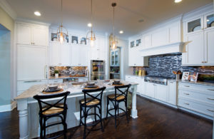 Bellmoore Park features luxury kitchen options with a large island overlooking the living area.